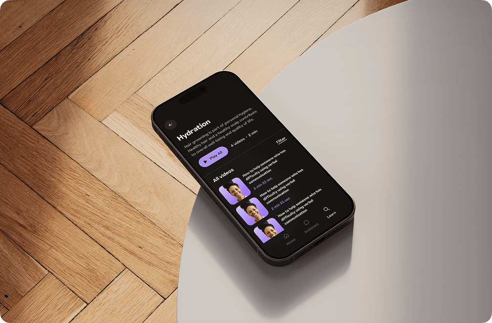 Boost Digital Assitant on a phone resting on the edge of a desk